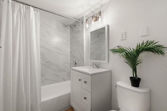 full bathroom with shower / bath combo, vanity, and toilet