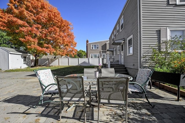 view of patio with a fenced backyard and outdoor dining space