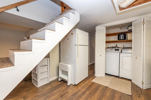 washroom featuring dark hardwood / wood-style flooring and independent washer and dryer