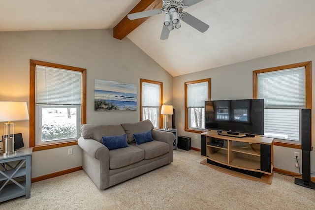 carpeted living room with a healthy amount of sunlight and vaulted ceiling with beams