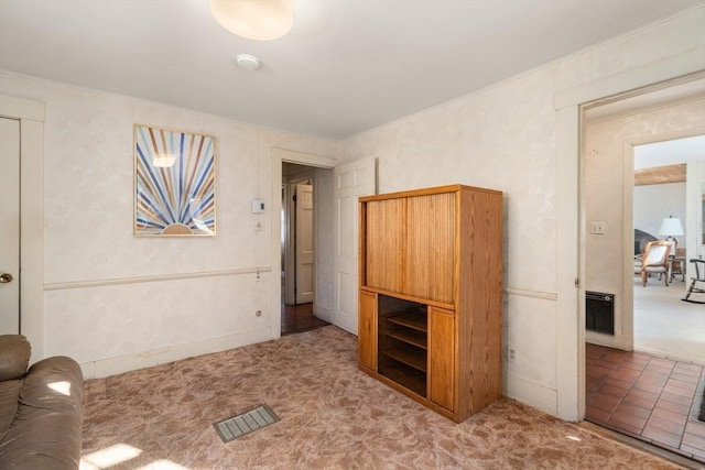 interior space featuring visible vents and carpet flooring