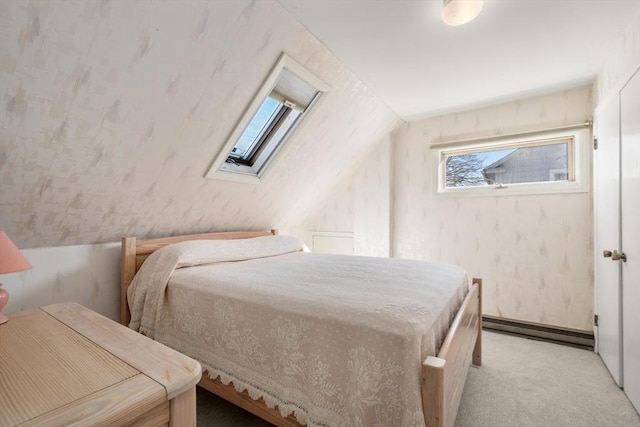 bedroom with light carpet, a baseboard heating unit, and vaulted ceiling