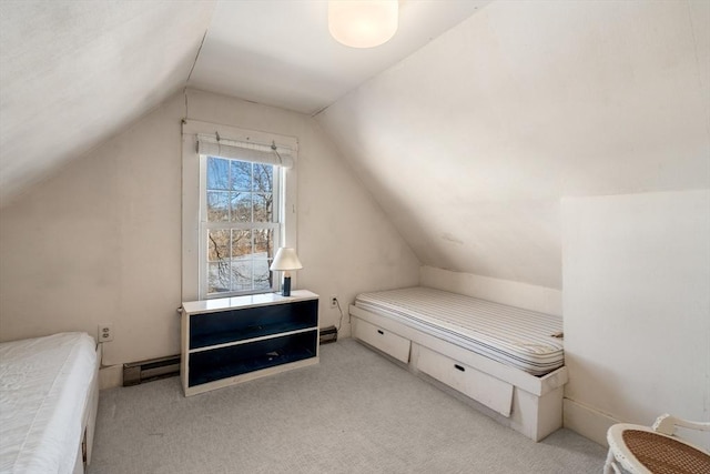 bedroom with carpet, a baseboard heating unit, and vaulted ceiling