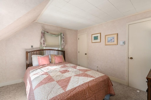 carpeted bedroom featuring lofted ceiling