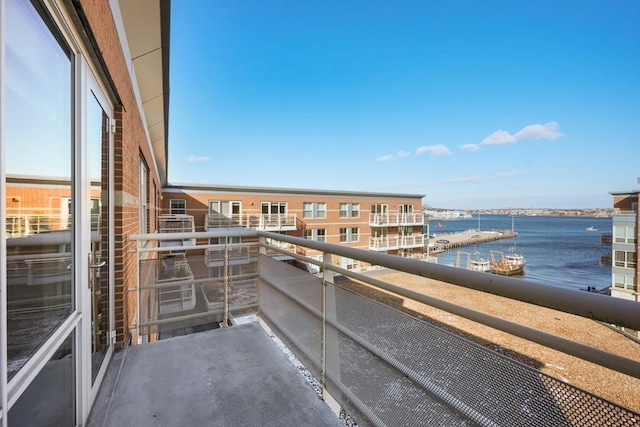 balcony featuring a water view