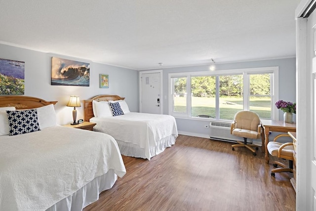 bedroom featuring crown molding and dark hardwood / wood-style flooring