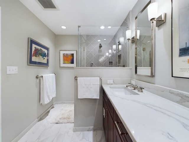 bathroom featuring vanity, tile patterned flooring, and an enclosed shower