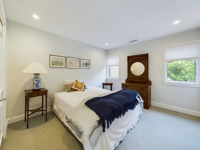 bedroom with light colored carpet