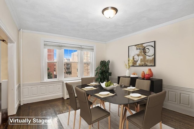 132 Sewall Ave Unit B, Brookline, MA 02446 - dining space with wood finished floors, crown molding, a wainscoted wall, and a decorative wall