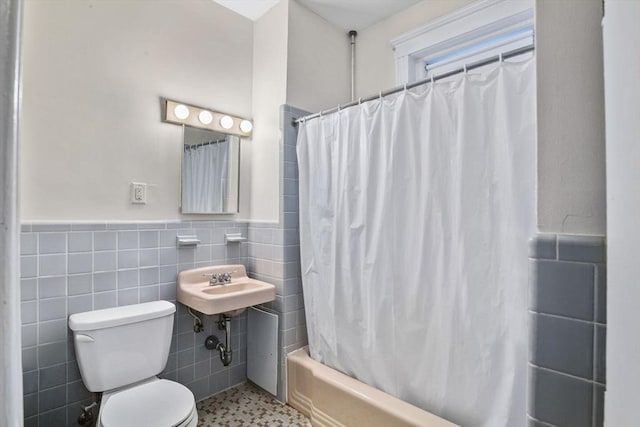 132 Sewall Ave Unit B, Brookline, MA 02446 - bathroom featuring tile walls, shower / tub combo with curtain, and wainscoting