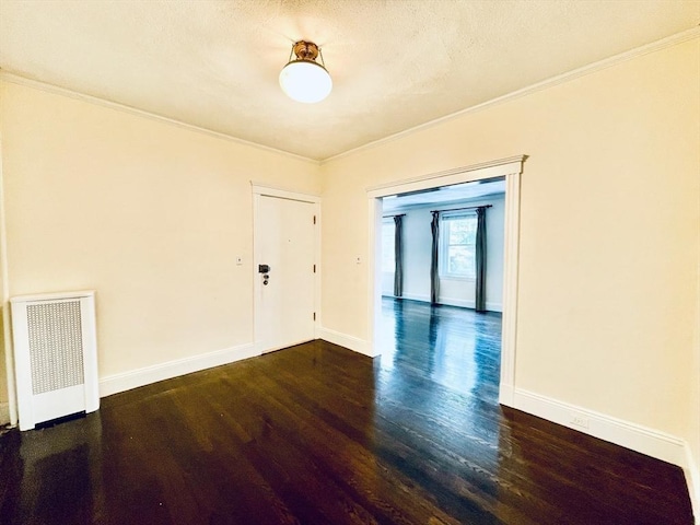 132 Sewall Ave Unit B, Brookline, MA 02446 - unfurnished room with wood finished floors, crown molding, and radiator heating unit
