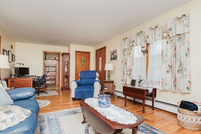 living room featuring light hardwood / wood-style flooring and baseboard heating