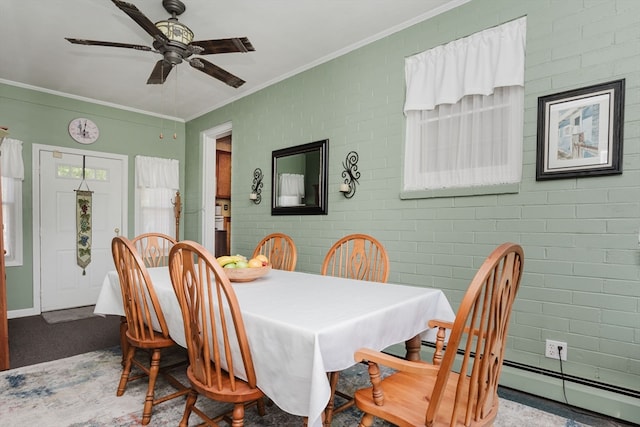 dining area with brick wall, a baseboard radiator, ornamental molding, and ceiling fan