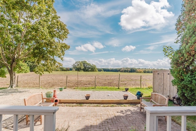 view of yard with a patio area and a rural view