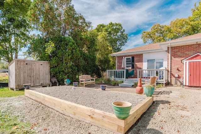 exterior space featuring a deck and a shed