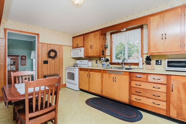 kitchen featuring sink and white appliances