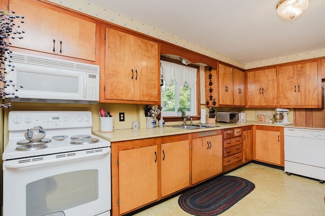 kitchen with white appliances and sink