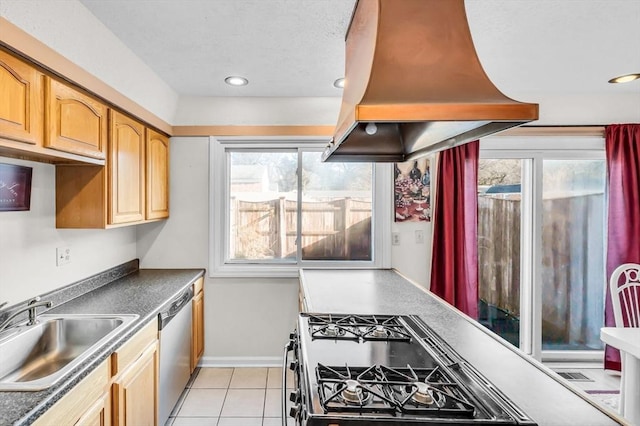 kitchen with sink, light tile patterned floors, island exhaust hood, and appliances with stainless steel finishes