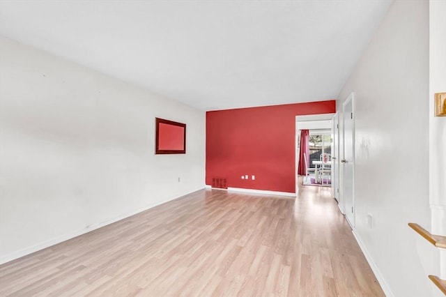 empty room with light hardwood / wood-style floors