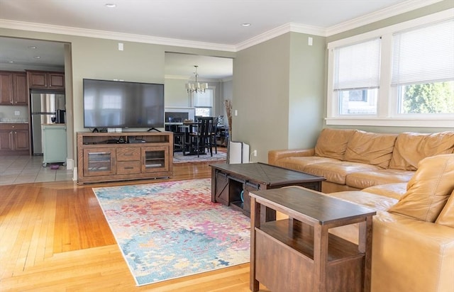 103 Maple Rd, Longmeadow, MA 01106 - living area with plenty of natural light, a chandelier, light wood finished floors, ornamental molding, and recessed lighting