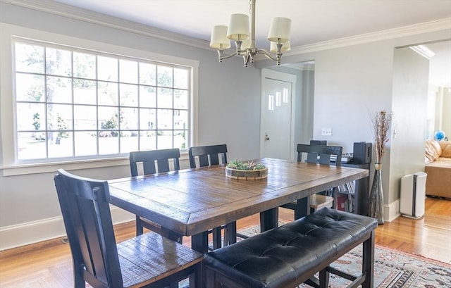 103 Maple Rd, Longmeadow, MA 01106 - dining space featuring a chandelier, light wood-type flooring, baseboards, and crown molding