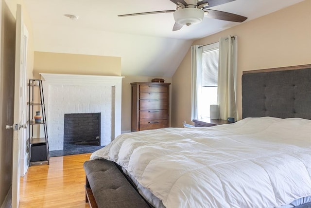 103 Maple Rd, Longmeadow, MA 01106 - bedroom with lofted ceiling, light wood-style flooring, a fireplace, and a ceiling fan