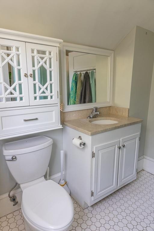 103 Maple Rd, Longmeadow, MA 01106 - bathroom with toilet, vanity, and baseboards