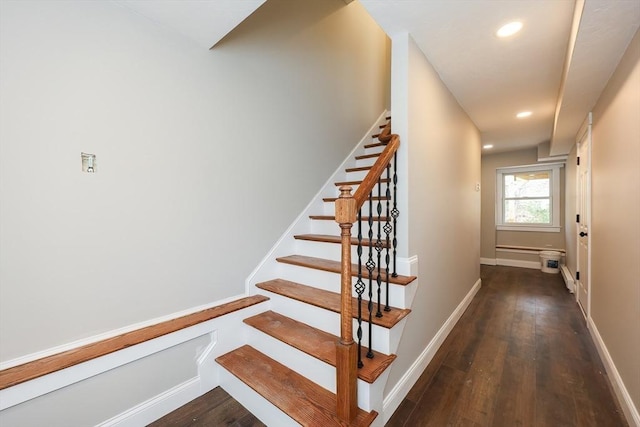 stairs featuring hardwood / wood-style floors