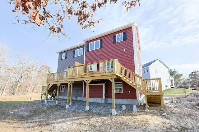 back of house with a wooden deck