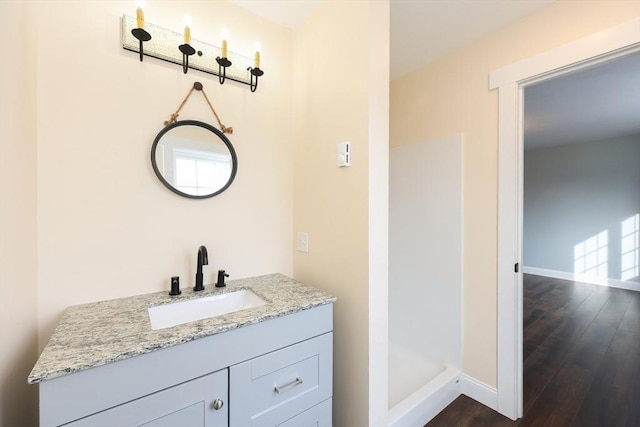 bathroom featuring hardwood / wood-style floors and vanity