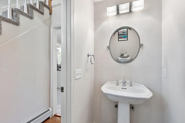 bathroom with a baseboard heating unit