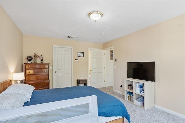 carpeted bedroom featuring baseboards