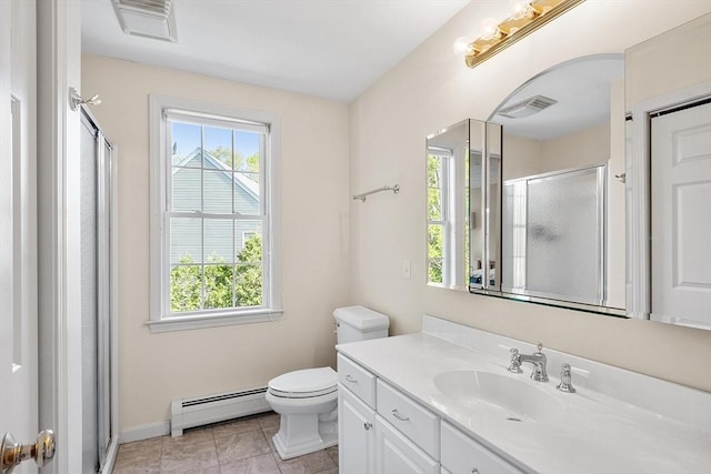 bathroom featuring baseboard heating, a shower stall, toilet, vanity, and baseboards