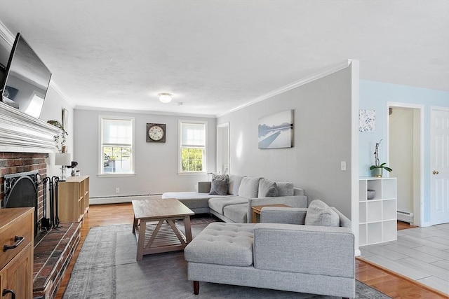 living area with a baseboard radiator, ornamental molding, wood finished floors, and a brick fireplace