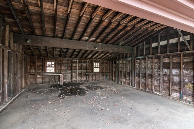 miscellaneous room with a healthy amount of sunlight and vaulted ceiling
