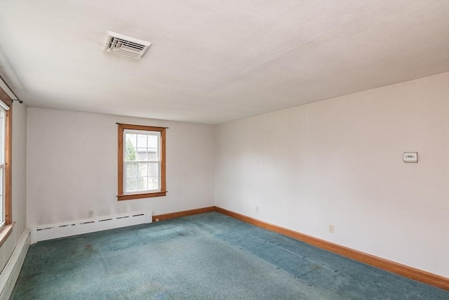 carpeted empty room featuring a baseboard heating unit, visible vents, and baseboards