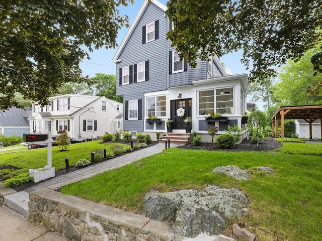 34 Rockland St, Melrose, MA 02176 - view of front of property with a front yard and a carport