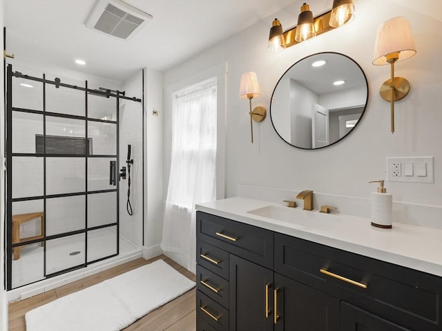 34 Rockland St, Melrose, MA 02176 - full bath with vanity, a shower stall, wood finished floors, and recessed lighting