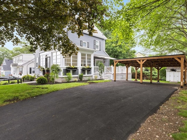 34 Rockland St, Melrose, MA 02176 - view of front of home with a storage shed, a detached carport, and driveway