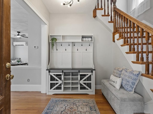 34 Rockland St, Melrose, MA 02176 - mudroom with wood finished floors, ceiling fan, and a wall mounted air conditioner