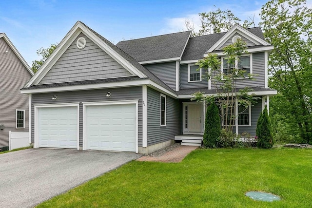 11 Bigelow Dr Unit 11, Berlin, MA 01503 - view of front of house featuring asphalt driveway, a garage, a front yard, and a shingled roof