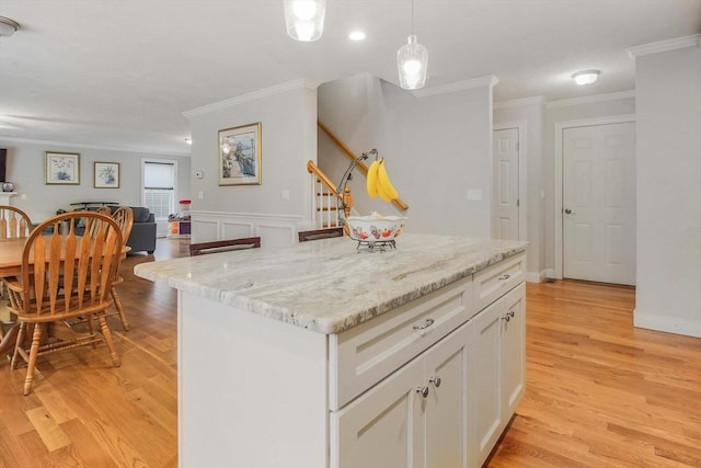 11 Bigelow Dr Unit 11, Berlin, MA 01503 - kitchen with ornamental molding, white cabinetry, light wood-style floors, hanging light fixtures, and a kitchen island