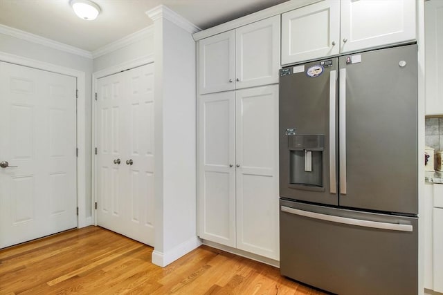11 Bigelow Dr Unit 11, Berlin, MA 01503 - kitchen with stainless steel fridge with ice dispenser, light wood finished floors, crown molding, white cabinets, and baseboards