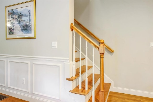 11 Bigelow Dr Unit 11, Berlin, MA 01503 - staircase with a wainscoted wall, wood finished floors, and a decorative wall