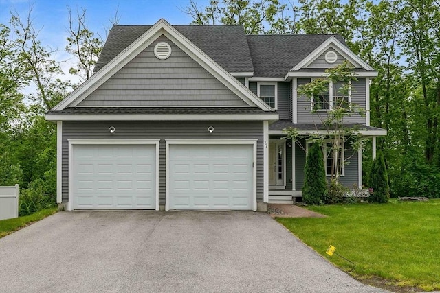 11 Bigelow Dr Unit 11, Berlin, MA 01503 - view of front of house with asphalt driveway, a shingled roof, an attached garage, a front yard, and covered porch