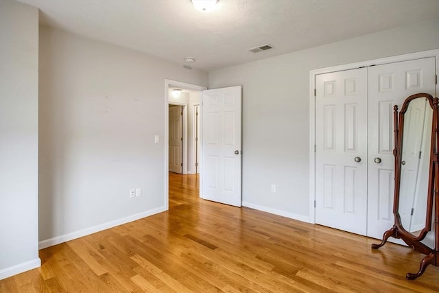 11 Bigelow Dr Unit 11, Berlin, MA 01503 - unfurnished bedroom with light wood-style flooring, baseboards, and a closet