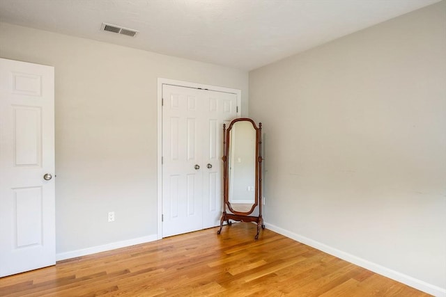 11 Bigelow Dr Unit 11, Berlin, MA 01503 - unfurnished bedroom featuring light wood finished floors, baseboards, and a closet