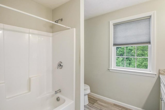 11 Bigelow Dr Unit 11, Berlin, MA 01503 - bathroom featuring toilet, vanity, wood finished floors, bathing tub / shower combination, and baseboards