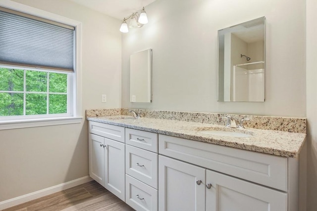 11 Bigelow Dr Unit 11, Berlin, MA 01503 - full bath featuring double vanity, wood finished floors, and baseboards