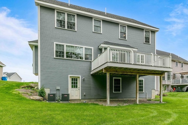 11 Bigelow Dr Unit 11, Berlin, MA 01503 - back of property featuring a wooden deck, a lawn, and central AC